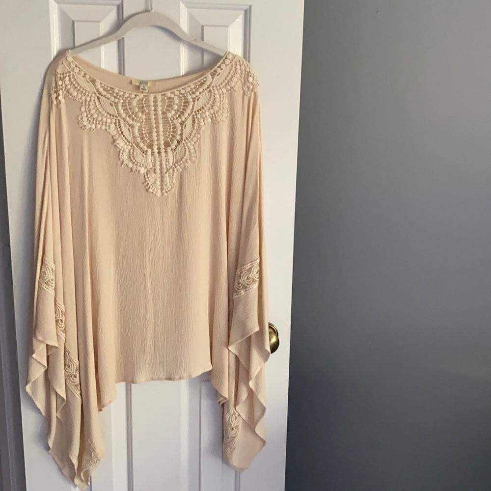 Cream blouse with lace-like details